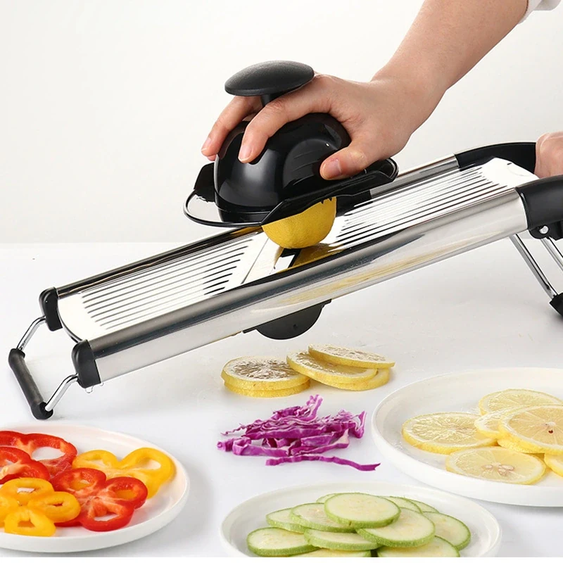 Existing seller catalog photo of a mandoline slicer with hand guard; not a safety test
